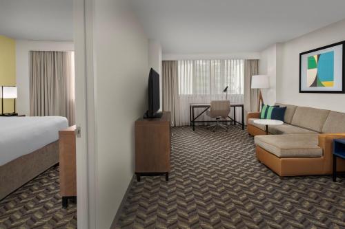 a hotel room with a bed and a living room at Residence Inn by Marriott Washington - DC/Foggy Bottom in Washington, D.C.