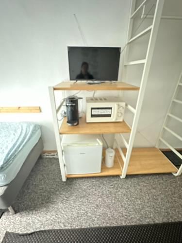 TV a/nebo společenská místnost v ubytování Bigus
