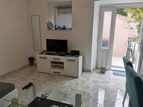 Μια τηλεόραση ή/και κέντρο ψυχαγωγίας στο Getaway Seaside Sweet