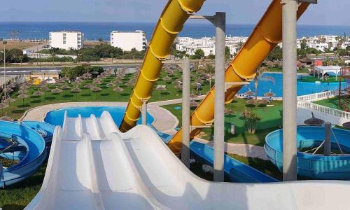 a water slide at a resort with a water park at Casa Marina Smir in Marina Smir