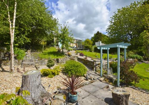 a garden with a park with a playground at Bonny Barn in Harbottle