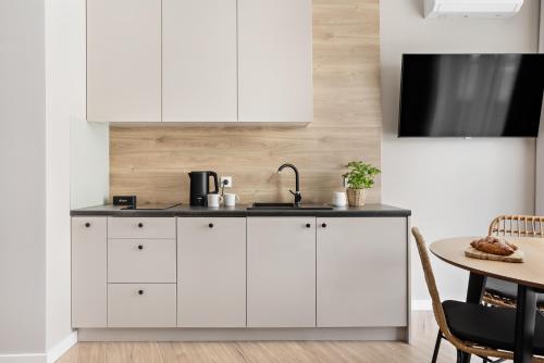 Η κουζίνα ή μικρή κουζίνα στο Artis Apartments by Housine