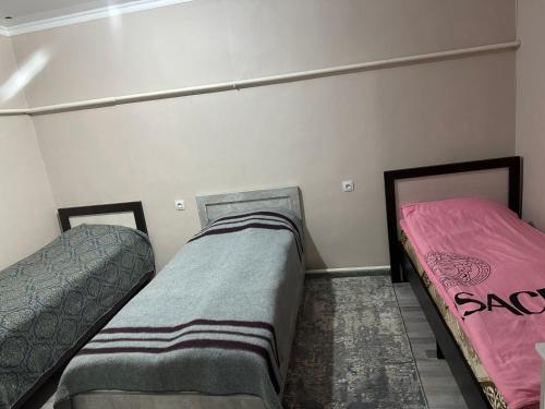a room with two beds in a room at Pamko in Naryn