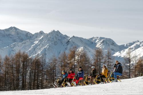 a group of people standing on top of a snow covered mountain at Aktiv Hotel & Spa Hannigalp in Grächen