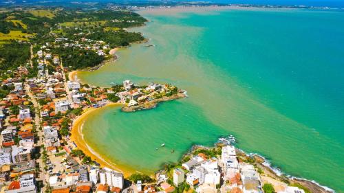 an aerial view of a beach and the ocean at Casa com os pés no mar em Iriri ES in Anchieta
