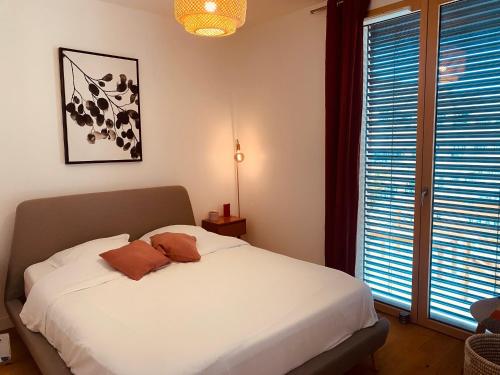 Posteľ alebo postele v izbe v ubytovaní Appartement T3 Confluence
