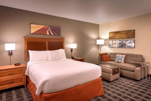 a hotel room with a bed and a chair at TownePlace Suites by Marriott Yuma in Yuma