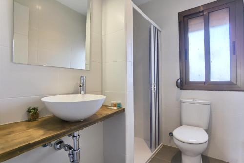 a bathroom with a sink and a toilet and a mirror at LEON INMO Apartment Dante - 15774 in Empuriabrava