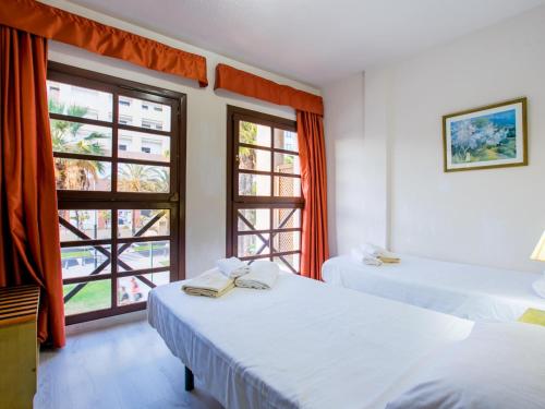 Postel nebo postele na pokoji v ubytování 104 Andorra apartment close to the beach