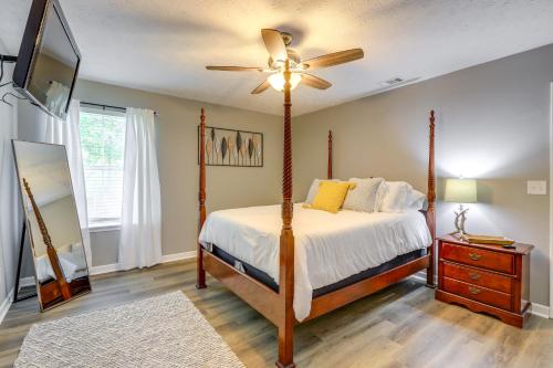 a bedroom with a bed and a ceiling fan at Decatur Vacation Rental with Fenced Yard! in Decatur