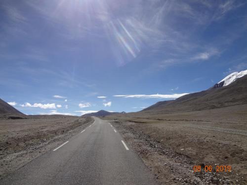 an empty road in the middle of a desert at The Bliss Homestay in Gangtok