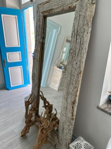 a mirror sitting on the floor in a room at Villa Sylvia in Symi