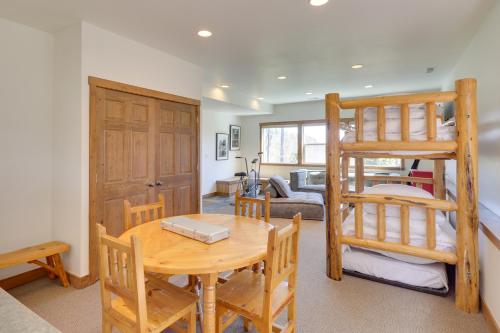 a dining room with a table and a bunk bed at Ski-InandSki-Out Whitefish Duplex with Hot Tub! in Whitefish