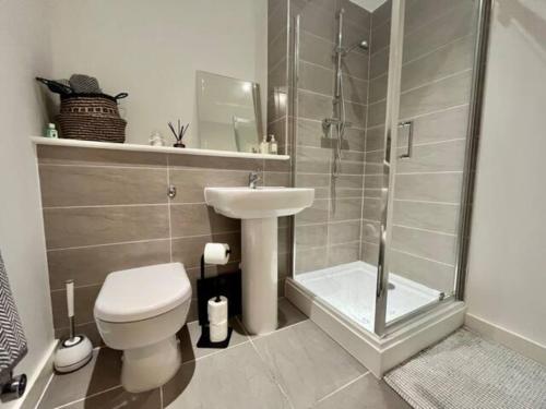 a bathroom with a toilet and a sink and a shower at BOLD Apartments - Liverpool City Centre in Liverpool