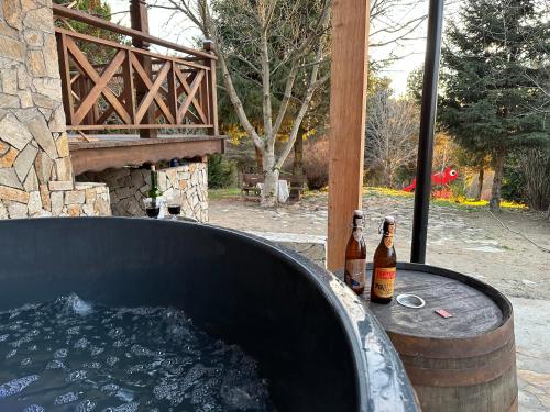 two bottles of beer sitting in a hot tub at Anielski Zakątek Solina - balia z jacuzzi i sauna w cenie pobytu in Solina