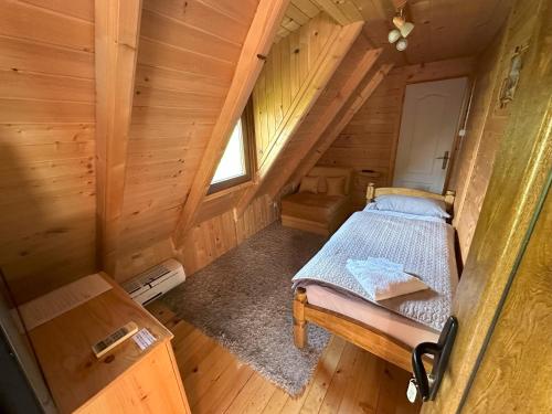 an overhead view of a bedroom in a log cabin at Vila Boska Palic in Palić