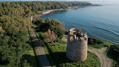 an aerial view of a castle next to the water at La Villetta in Pula