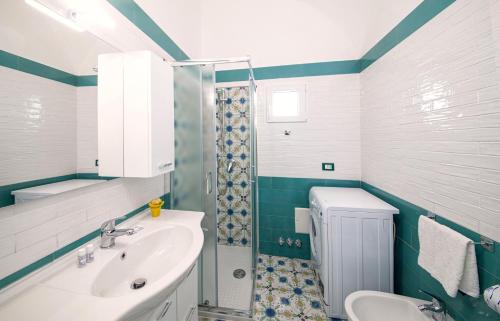 a bathroom with a sink and a shower at Ischia Domus in Ischia