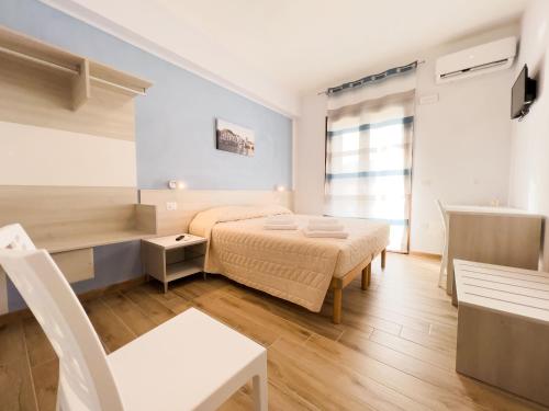 Postel nebo postele na pokoji v ubytování B&B BABBU MEU