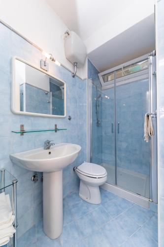 a bathroom with a sink and a toilet and a shower at Birago22Capri in Capri