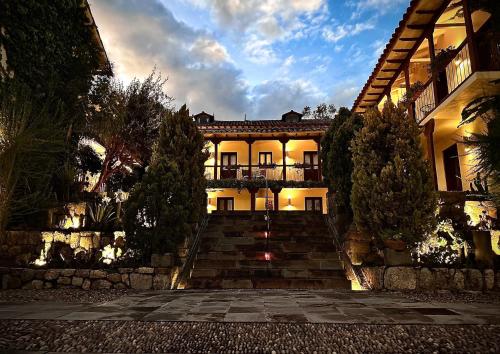 a large house with stairs in front of it at Casa Cartagena Boutique Hotel & Spa in Cusco