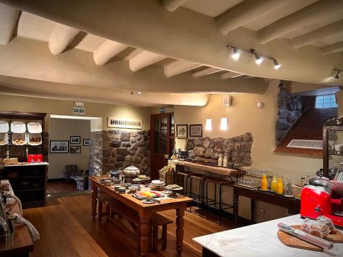 a large kitchen with a table in a room at Casa Cartagena Boutique Hotel & Spa in Cusco