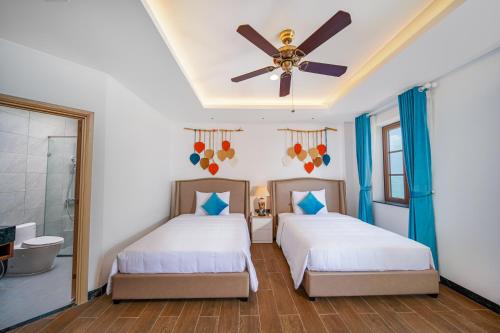 Roma Hotel Phu Quoc - Free Airport Shuttle & Sunset Town Tourにあるベッド