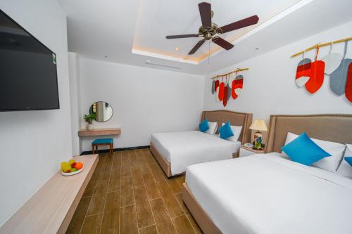 Roma Hotel Phu Quoc - Free Airport Shuttle & Sunset Town Tourにあるベッド