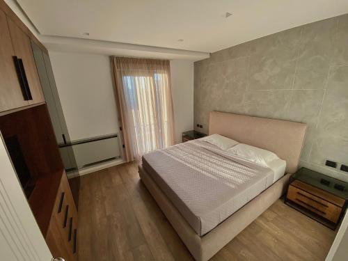 Giường trong phòng chung tại Lux Apartment 01 + Free Parking