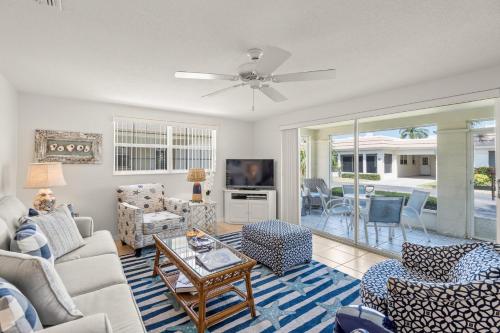 a living room with a couch and a table at Island House Beach Resort 37 in Siesta Key