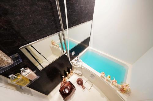 an overhead view of a bathroom with a tub at Papillon Paradis Higashi-Shinjuku in Tokyo