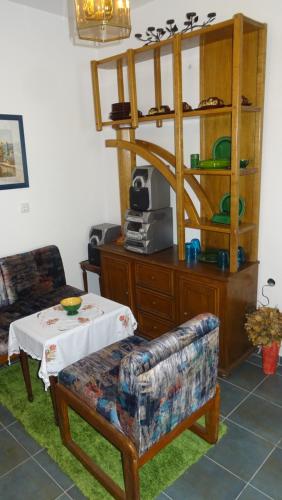 a living room with a table and a couch at Nikiva I in Ćuprija