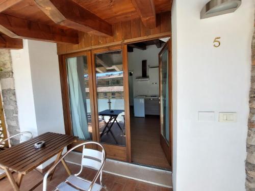 a small room with a wooden table and chairs at Pizzocolo resort fasano in Gardone Riviera