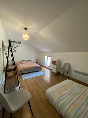 מיטה או מיטות בחדר ב-Petit cocon au cœur du Morvan