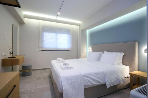 Ένα ή περισσότερα κρεβάτια σε δωμάτιο στο Carabella Residence
