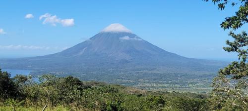 a view of a mountain in the distance at Hostal Maria in Rivas