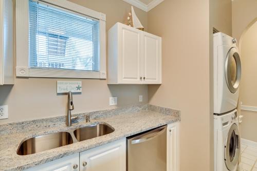 a kitchen with a sink and a dishwasher at Golf, Swim and Unwind at Bright Myrtle Beach Condo! in Myrtle Beach