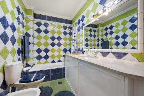 a bathroom with a toilet and a sink at My Friendly House in Lagos