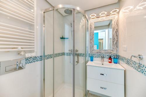a bathroom with a shower and a sink at Marina Banus in Marbella