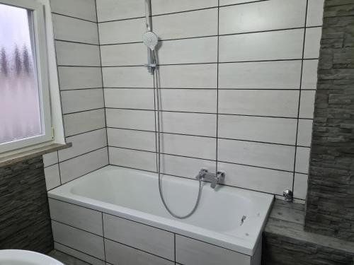 a bathroom with a shower with a bath tub at Bergliebe - Talstation in Blaichach