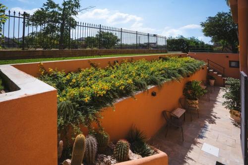 a balcony with plants on the side of a building at Le Monachelle Luxury in Eboli