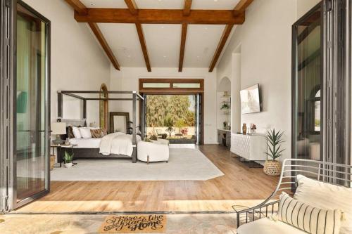 a living room with a bed and a couch at The Zenda Estate in Indio