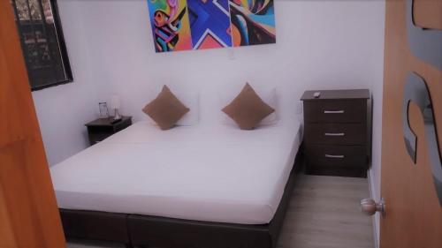 En eller flere senge i et værelse på Hotel BLH 2