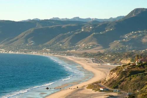 a view of a beach with mountains in the background at 30 PCT OFF! Malibu Charming Suite, Ocean View, King Bed in Malibu
