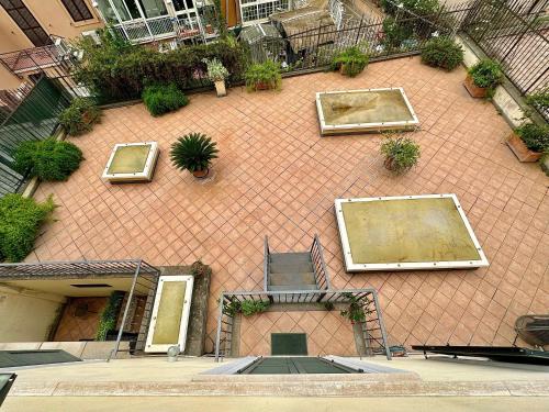an aerial view of a brick building with plants at Hotel Principe Di Piemonte in Rome