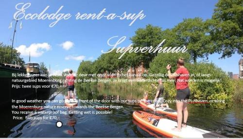 a group of people on a boat in the water at Ecolodge Tilburg met zwembad in groene oase bij centrum in Tilburg