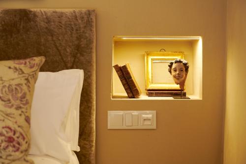 a man in a mirror in a hotel room at Casa Rural Sullà in Tremp