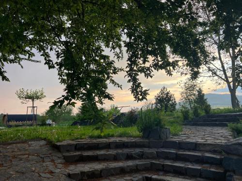 a set of stone stairs in a park with trees at Horní Strakův mlýn in Úštěk