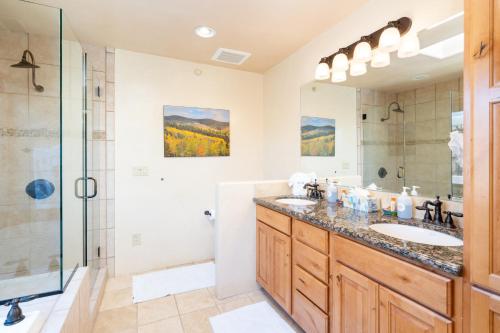 a bathroom with two sinks and a shower at El Corazon 12, Luxury 2 BRs, Sleeps 5 in Santa Fe