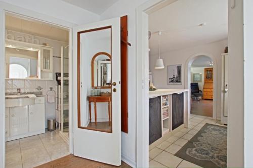 a kitchen and living room with an open door at Private Apartment in Hannover